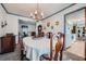 Open dining room with chandelier and connection to kitchen at 4113 Stutz Ct, Tucker, GA 30084