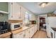 Functional kitchen with white cabinets and classic design features at 4113 Stutz Ct, Tucker, GA 30084