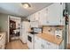Compact kitchen with white appliances and ample counter space at 4113 Stutz Ct, Tucker, GA 30084
