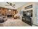 Comfortable living room with brick fireplace, built-in bookshelves, and plush seating at 4113 Stutz Ct, Tucker, GA 30084