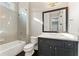 Stylish bathroom with dark vanity, tub and shower combo at 2315 Monet Dr, Cumming, GA 30041