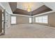 Expansive main bedroom features carpet, high ceilings, detailed ceiling and large windows at 2315 Monet Dr, Cumming, GA 30041