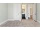 Neutral carpeted bedroom with open doors at 2315 Monet Dr, Cumming, GA 30041