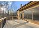 Exterior deck boasts natural wood and a black metal railing surrounding the back of the home at 2315 Monet Dr, Cumming, GA 30041