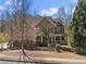 Beautiful exterior elevation showcases brick and siding architecture with manicured front yard at 2315 Monet Dr, Cumming, GA 30041
