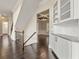Hallway with dark hardwood flooring and stairway leading to the upper level at 2315 Monet Dr, Cumming, GA 30041