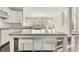 Open kitchen with center island, stainless appliances, hardwood floors, and granite countertops at 2315 Monet Dr, Cumming, GA 30041