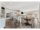 Spacious kitchen with stainless steel appliances, granite counters, island with seating, and adjacent dining at 2315 Monet Dr, Cumming, GA 30041
