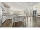 Open kitchen and living area filled with natural light and hardwood flooring offer ample space at 2315 Monet Dr, Cumming, GA 30041