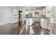 Spacious kitchen with white cabinetry, granite countertops, stainless appliances, and center island with bar at 2315 Monet Dr, Cumming, GA 30041