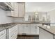Well-appointed kitchen featuring white cabinets, stainless steel appliances, and granite countertops at 2315 Monet Dr, Cumming, GA 30041