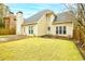 Home exterior featuring a well-manicured lawn, a patio, and windows bringing in natural light at 2698 Glenrose Hl, Atlanta, GA 30341