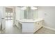 A spacious bathroom featuring a double vanity with a large mirror and modern fixtures, complemented by stylish flooring at 2698 Glenrose Hl, Atlanta, GA 30341