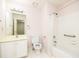 Cozy bathroom with a bathtub and shower combination, a classic vanity, and neutral-toned walls at 2698 Glenrose Hl, Atlanta, GA 30341