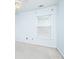 Bright bedroom featuring a ceiling fan, window with blinds, and neutral carpet at 2698 Glenrose Hl, Atlanta, GA 30341