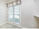 Walk-in closet with a window, wire shelving, offering ample storage space and natural light at 2698 Glenrose Hl, Atlanta, GA 30341