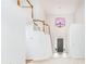 Entryway featuring soaring ceilings, a staircase with wooden handrail, and an art-glass window above the front door at 2698 Glenrose Hl, Atlanta, GA 30341