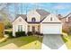 Charming single-Gathering home featuring manicured lawn, attached garage, and inviting front entryway at 2698 Glenrose Hl, Atlanta, GA 30341