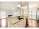 Open-concept kitchen featuring granite countertops, a stainless steel dishwasher, and seamless flow to the living area at 2698 Glenrose Hl, Atlanta, GA 30341