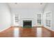 Spacious living room features a fireplace, hardwood flooring, and plenty of natural light from large windows at 2698 Glenrose Hl, Atlanta, GA 30341