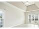 Bright, airy room features vaulted ceiling, multiple windows, and light-colored flooring; awaiting your personal touch at 2698 Glenrose Hl, Atlanta, GA 30341