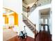 Bright foyer featuring hardwood floors, staircase with wrought iron spindles, and arched doorways at 3196 Moon Stone Ln, Snellville, GA 30039