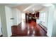 Hardwood floors extending from the hallway into a modern kitchen with stainless steel appliances at 3196 Moon Stone Ln, Snellville, GA 30039