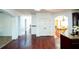 Elegant hallway with hardwood floors leading to the kitchen and dining room at 3196 Moon Stone Ln, Snellville, GA 30039