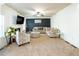 Spacious living room with patterned accent wall, fireplace, and large sofa at 3196 Moon Stone Ln, Snellville, GA 30039