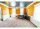 Bright office with unique ceiling, carpeted floors, and large windows offering ample natural light at 3196 Moon Stone Ln, Snellville, GA 30039