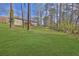 Large backyard with lush green lawn and trees at 3618 Mansfield Ln, Snellville, GA 30039