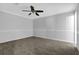 Cozy bedroom features plush carpet, neutral paint and a ceiling fan at 3618 Mansfield Ln, Snellville, GA 30039