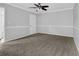 Neutral colored bedroom with ceiling fan, crown molding and new carpet at 3618 Mansfield Ln, Snellville, GA 30039