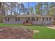 Attractive home featuring a well-kept lawn and inviting front porch at 3618 Mansfield Ln, Snellville, GA 30039