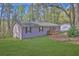 Well-maintained home with green lawn and a cozy front porch at 3618 Mansfield Ln, Snellville, GA 30039
