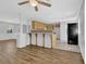 Open concept kitchen featuring breakfast bar with view into living room at 3618 Mansfield Ln, Snellville, GA 30039