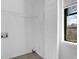Functional laundry room with utility hookups and natural light from a window at 3618 Mansfield Ln, Snellville, GA 30039