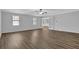Spacious living room with wood floors, ceiling fan, and bright natural light at 3618 Mansfield Ln, Snellville, GA 30039