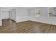 Open-concept living room featuring sleek flooring, bright lighting, and modern trim at 3618 Mansfield Ln, Snellville, GA 30039