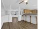 Open concept living room with columns and view of kitchen at 3618 Mansfield Ln, Snellville, GA 30039