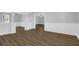 Modern living room with sleek flooring and open layout to adjacent rooms at 3618 Mansfield Ln, Snellville, GA 30039
