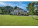 Charming two-story home with a large front yard and inviting covered porch at 4177 Sardis Church Rd, Buford, GA 30519