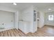 Well-lit laundry room with sink, cabinets, and access to the exterior at 4177 Sardis Church Rd, Buford, GA 30519