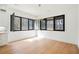 Sunlit dining room with modern light fixture and large windows overlooking the backyard at 5185 Cascade Rd, Atlanta, GA 30331