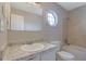 Bathroom featuring tub/shower combination, granite counters, decorative window, and neutral color scheme at 585 Lake Dr, Snellville, GA 30039