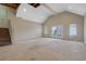 Large living room with tall ceilings, lots of natural light, and stairs to another level at 585 Lake Dr, Snellville, GA 30039