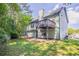 Spacious backyard featuring a deck and a patio perfect for outdoor entertaining and relaxation at 1202 W Briar Gate Ct, Riverdale, GA 30296