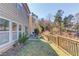 Backyard with a patio, a grassy area, and a wooden fence at 1554 Park Grove Dr, Lawrenceville, GA 30046