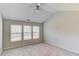 Bedroom features three large windows, neutral carpet, and a vaulted ceiling at 1554 Park Grove Dr, Lawrenceville, GA 30046