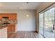 Open dining area with wood floors featuring a sliding door to a patio and stainless steel range at 1554 Park Grove Dr, Lawrenceville, GA 30046
